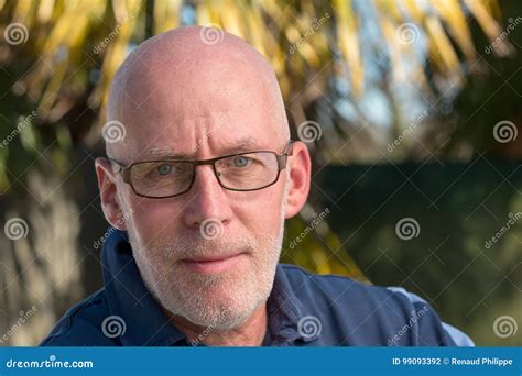 old bald man with glasses